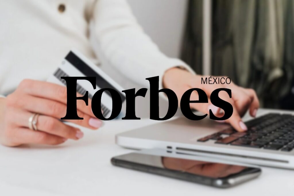 Forbes Mexico logo over a women holding a credit card and using a laptop